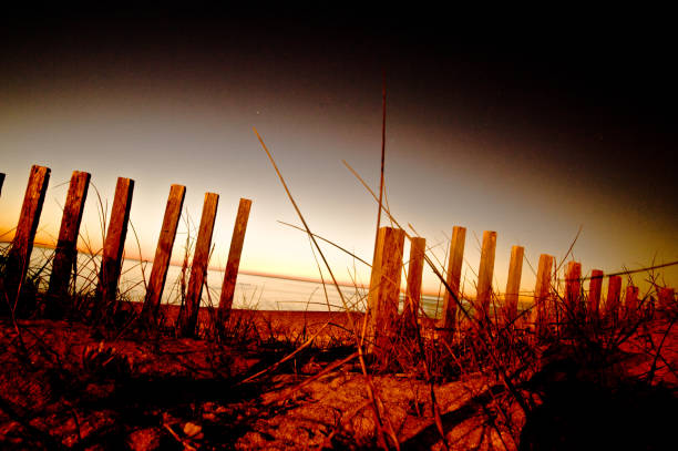 istock Wooden structure By The Seaside At Night 1057859774