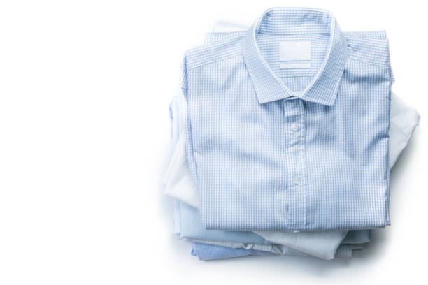 istock Stack of male folded shirts isolated 1057860508