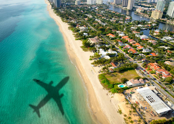 istock Shadows of airplane flying over Miami 1057868688