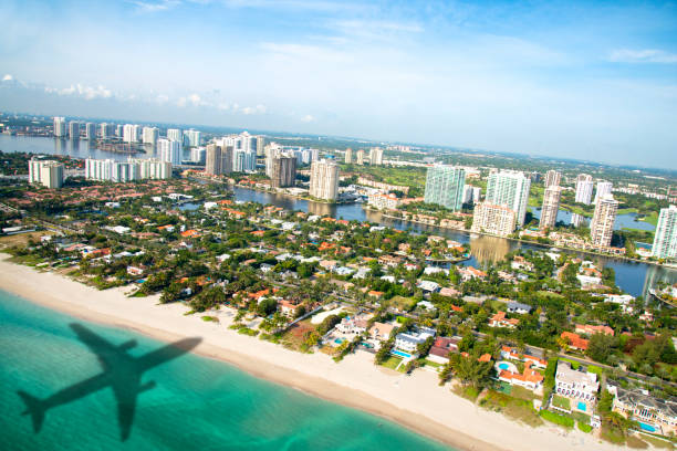 istock Shadows of airplane flying over Miami 1057868752