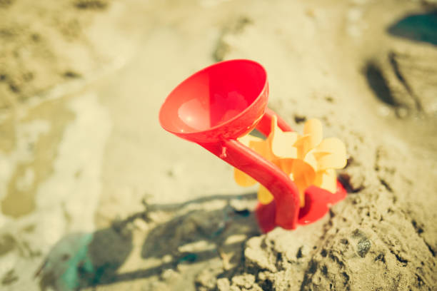 istock Baby toys on beach 1057872542