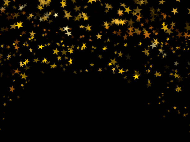 stelle di coriandoli dorati cadenti su sfondo nero - gold confetti star shape nobody foto e immagini stock