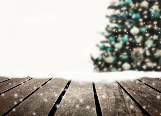 istock Christmas tree defocused and wooden plank 1057874540
