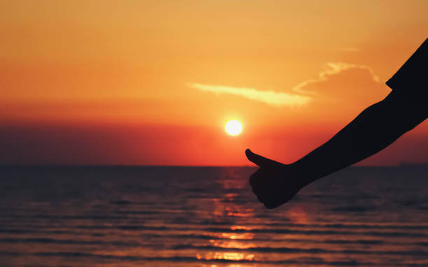 istock silhouette thumbs up hand sign 1057875788