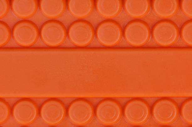 istock red plastic texture out of the box with a pattern 1057882100