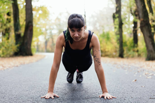 istock Fit young woman stretching in forest 1057885808