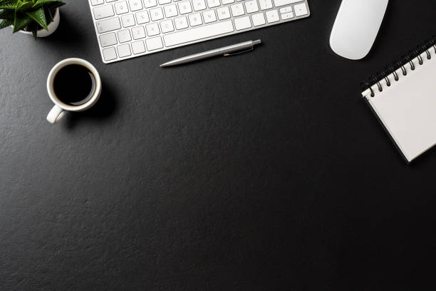 istock Overhead shot of office desktop 1057890130