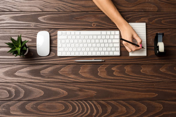 istock Overhead shot of modern office desktop 1057890196