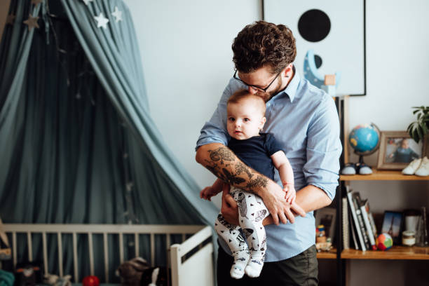istock Parents embracing their baby boy 1057892384