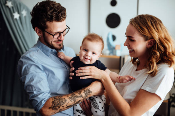 istock Parents embracing their baby boy 1057892490