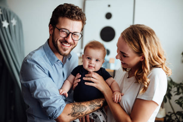 istock Parents embracing their baby boy 1057892494