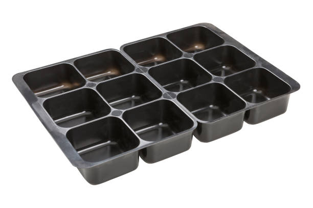 istock black plastic container for food, many cells, on a white background, side view, isolate 1057892584
