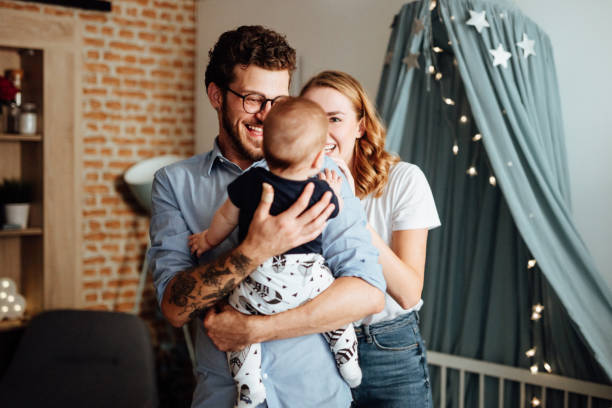 istock Parents playing hide and seek with their baby boy 1057894300