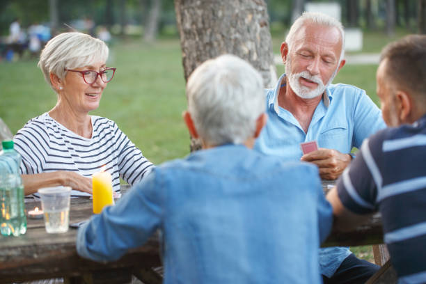 istock Senior people playing cards game 1057894820