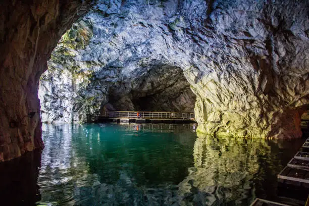 Photo of Marble quarry Ruskeala. Invalid marble quarry. Sights of Karelia in Russia. Quarry marble. Pieces of marble.