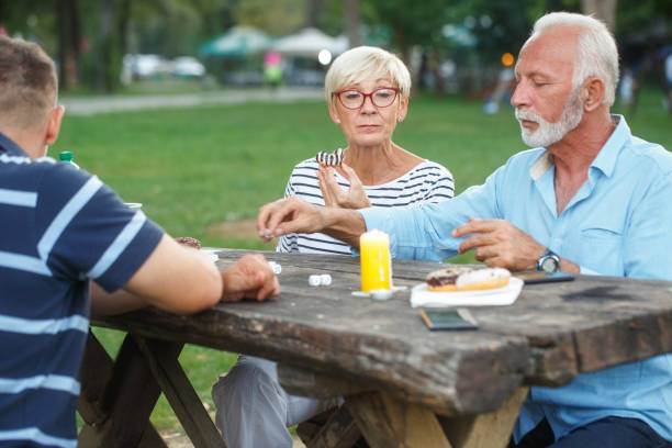 istock Senior people playing cards game 1057894948