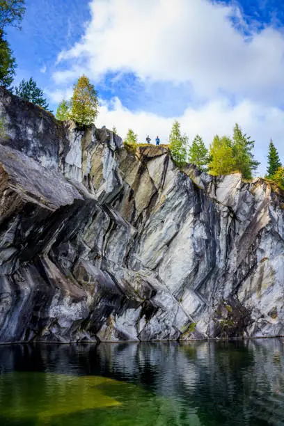 Photo of Marble quarry Ruskeala. Invalid marble quarry. Sights of Karelia in Russia. Quarry marble. Pieces of marble.