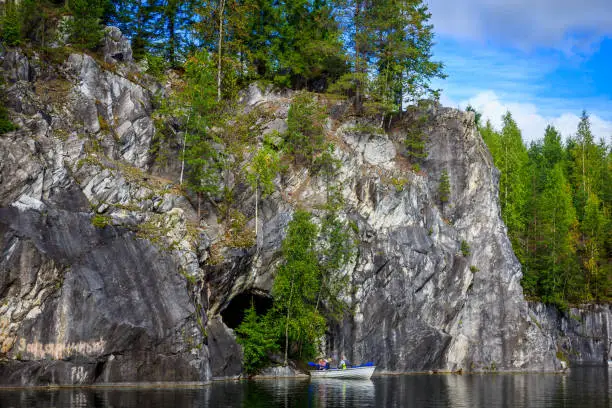 Photo of Marble quarry Ruskeala. Invalid marble quarry. Sights of Karelia in Russia. Quarry marble. Pieces of marble.