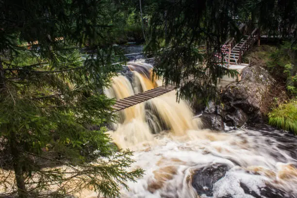 Photo of Ruskeala waterfalls. Water comes down a strong current. Waterfalls of Russia. Travel to Russia. Karelia,
