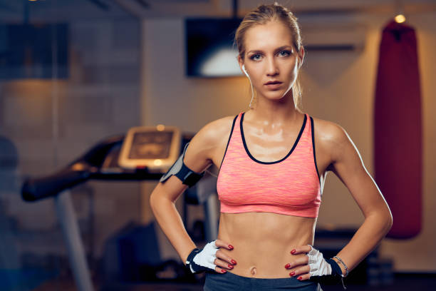 istock Woman posing in gym. 1057899470
