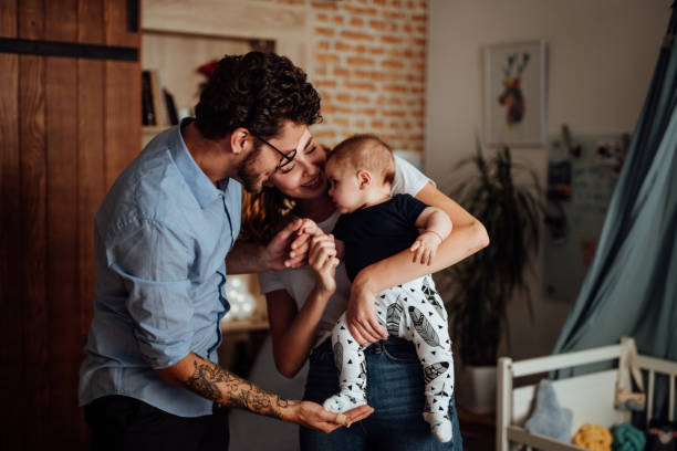 istock Parents Reading Book to their son 1057899798