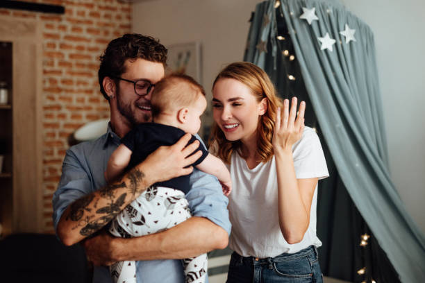 istock Parents embracing their baby boy 1057902034