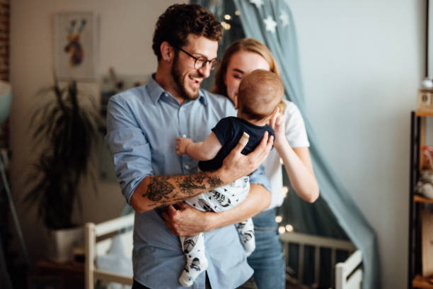 istock Parents embracing their baby boy 1057902164