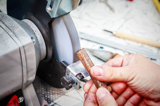istock Sharpening the steel billet on the grinding machine 1057909132