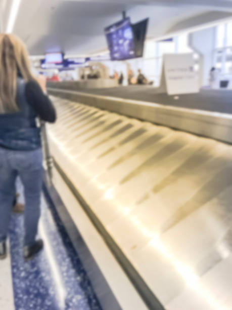 istock Blurry background baggage claim area at American airport 1057912820