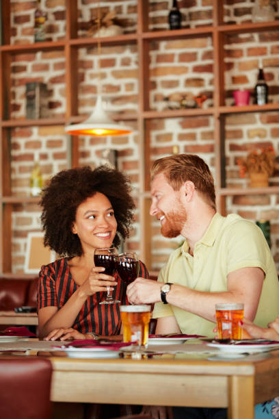 istock Group of friends having dinner at restaurant. 1057915972
