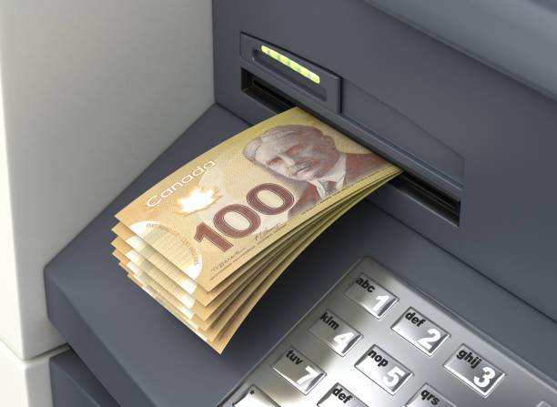istock Withdrawal Canadian Dollar From The ATM 1057916256