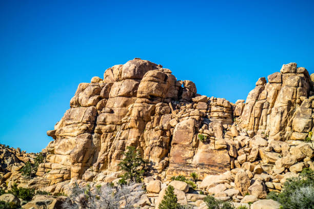 A natural rock formation of desert boulder rocks piled up together in Ryan Mountain at Joshua National Park