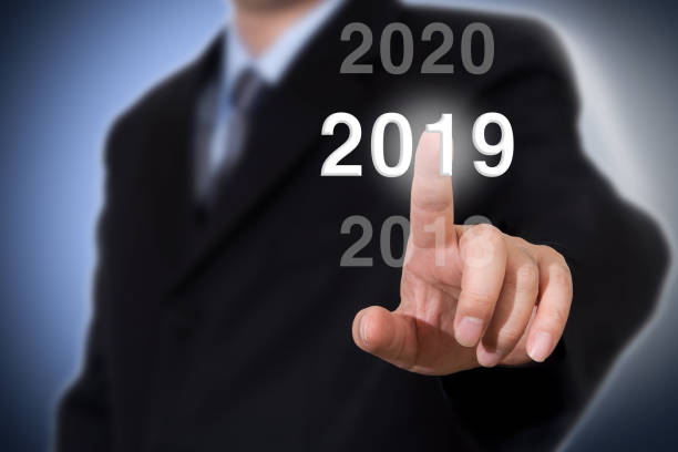 istock Businessman pointing year 2019. Businessman new year concept. 1057918708