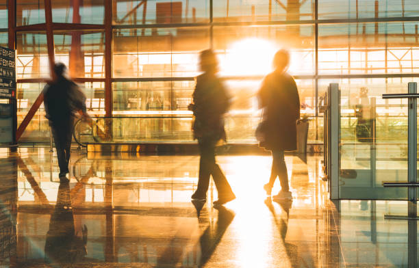 istock People catching flights at airport terminal. 1057921454