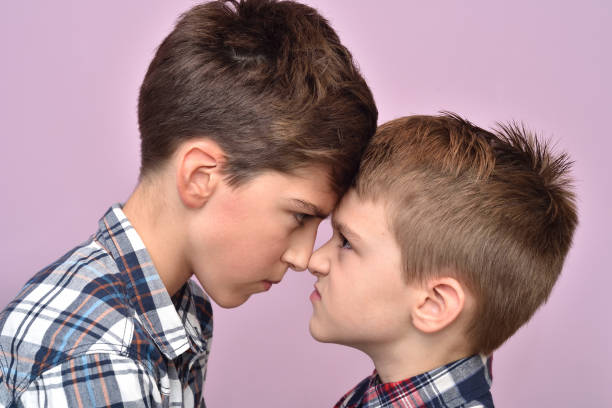 istock Two angry brothers quarreling 1057923328