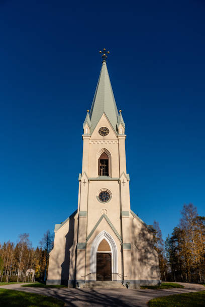 istock White Stone church in autumn sunshine 1057923868