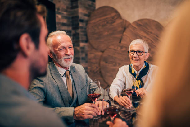istock Man drinking wine with family 1057924418