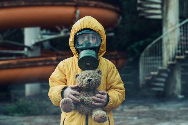 Air pollution Little boy wearing gas mask. Air pollution concept. biochemical weapon photos stock pictures, royalty-free photos & images