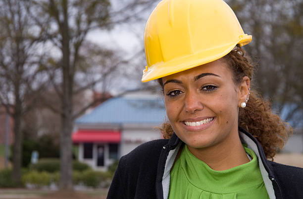 Construction supervisor wearing yellow helmet stock photo