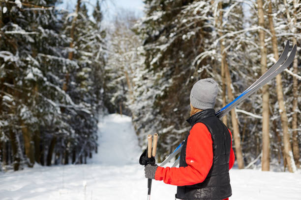 istock Woman with skis 1057936760