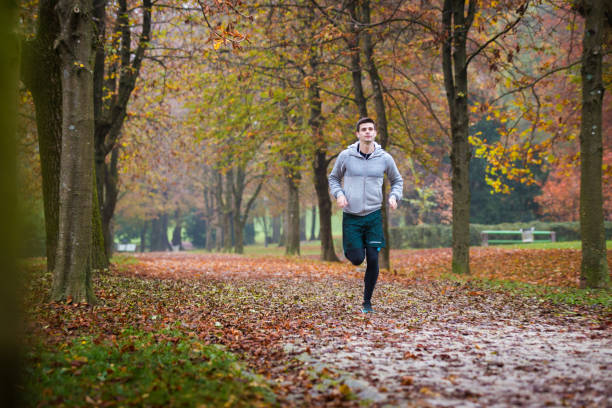 istock Autumn run in the park 1057936768