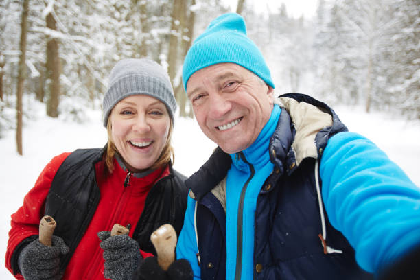istock Seniors in winter woods 1057937002