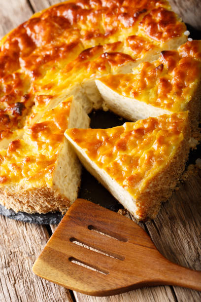 istock Homemade sliced rice pie with ricotta cheese close-up. vertical 1057939150