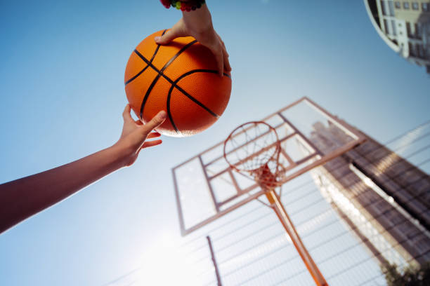 istock Low angle picture of female hands that throwing ball 1057939368