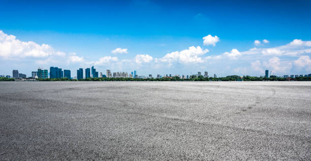 istock Asphalt road and modern city 1057941272