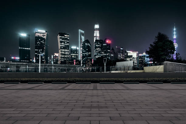istock Empty floor with modern skyline and buildings at night in Shanghai 1057944024