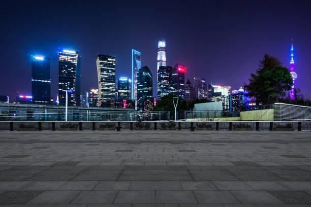 istock Empty floor with modern skyline and buildings at night in Shanghai 1057944438