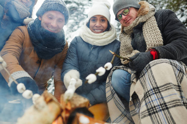 istock Cheerful young friends at camping 1057945552