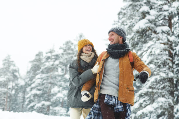 istock Jolly beautiful couple enjoying winter stroll 1057945592