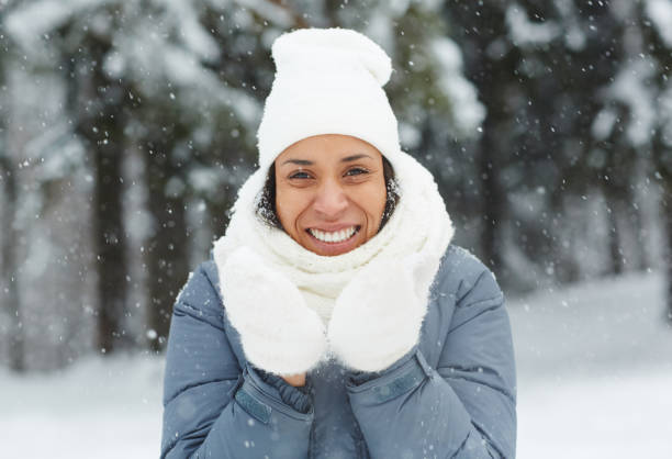 istock Attractive woman in mittens looking at camera 1057945608